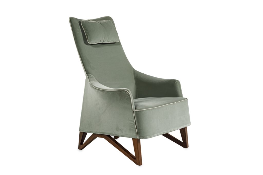 Bergère upholstered in mint green velvet with white stitching on a wooden structure on a white background