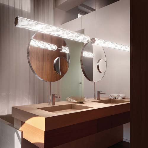horizontal lamp made of Lentiflex® prismatic base and silky print in a white tone with gold finishes