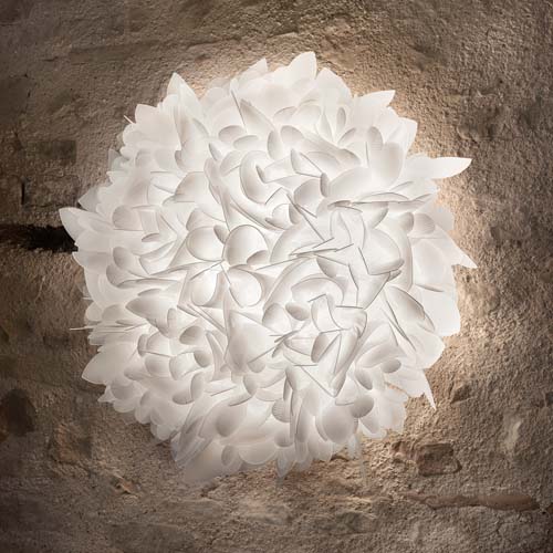 floor lamp made of natural pieces by hand in a white tone made in the shape of several flower petals