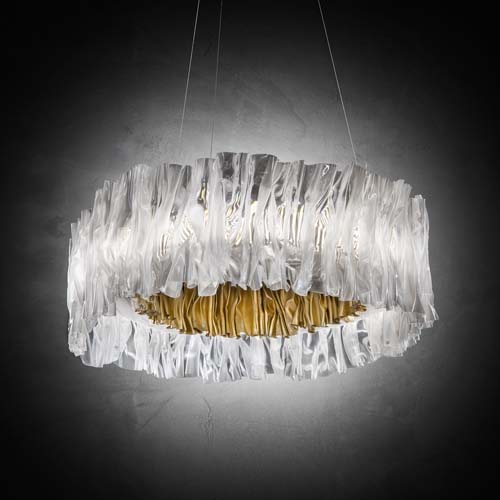 lamp made in the shape of an accordion on an aluminum base in a silver tone with gold on a black background
