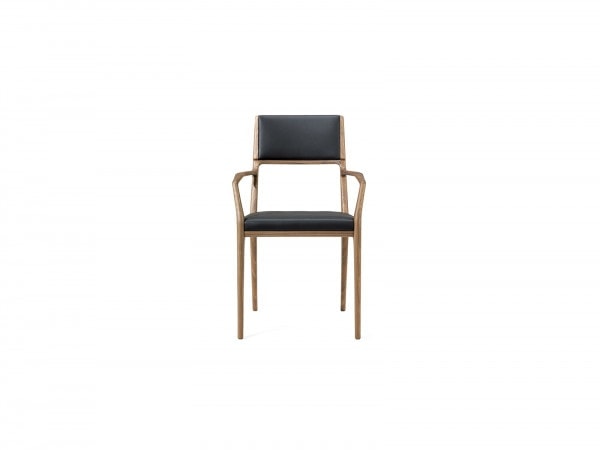 chair made of walnut wood base in a brown tone and upholstered in alamo fabric in a black tone