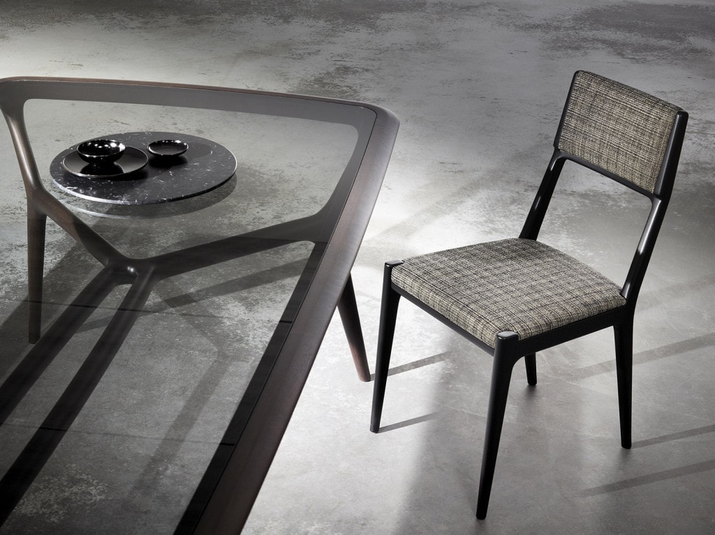 chair made of walnut brown wood base and upholstered in gray fabric