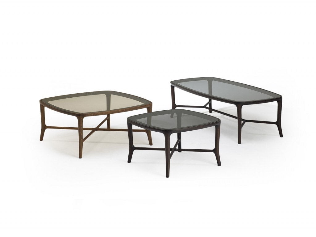 three low coffee tables made of walnut wood and glass in bronze and black tones