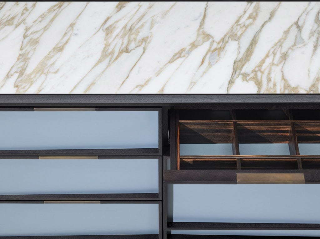 sideboard with front drawers made of wood top in white marble in a sky blue tone