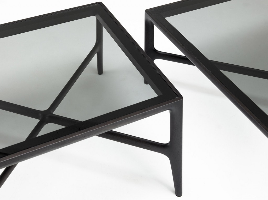 two coffee tables made of walnut wood with cirstal top in a transparent black tone