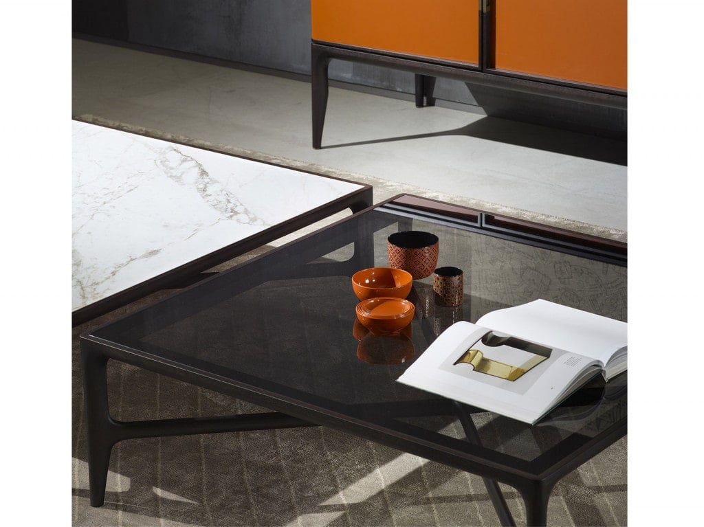 small table made of wood with glass top in a black tone in a living roon