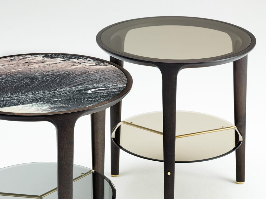 two small tables made of wood with marble top on a glass in brown, white and beige tones