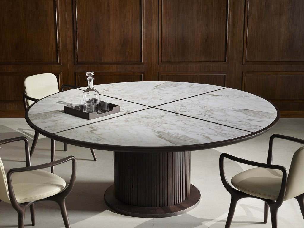 table made of brass base and brown wood structure and white marble top in a office
