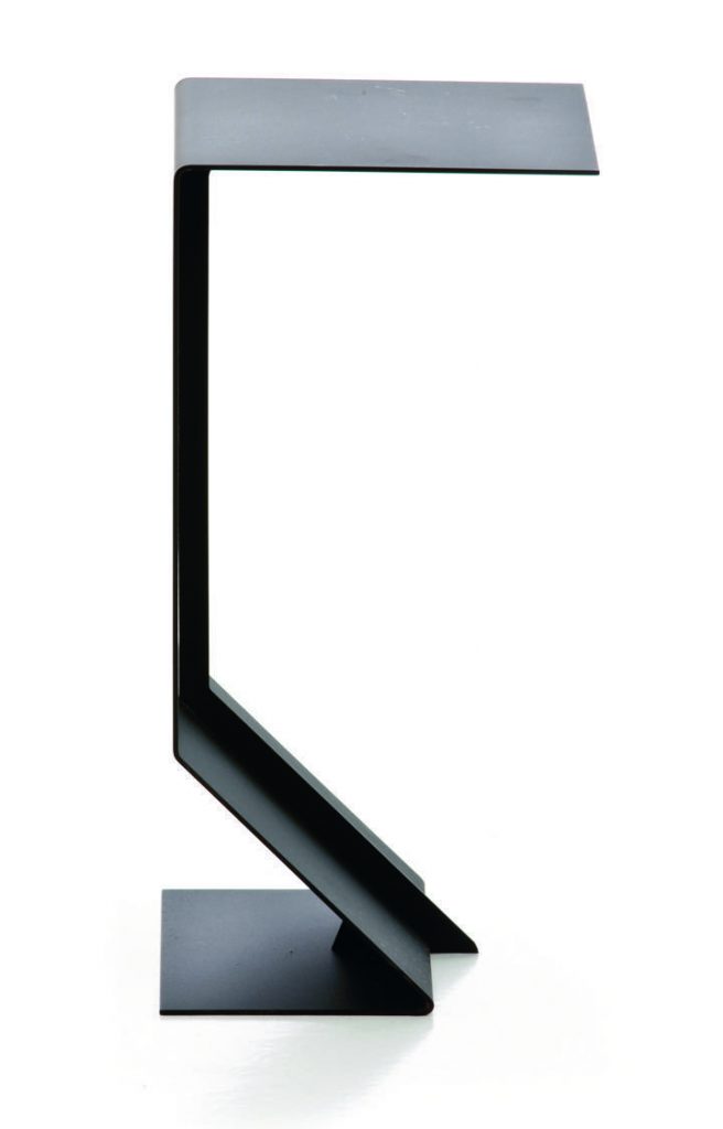 Sculptured side table in a unique design made from a metal base in a black tone