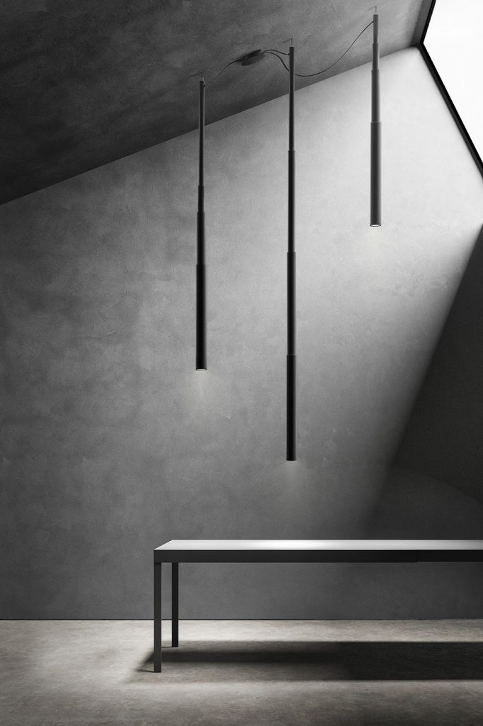 three hanging lamps in the shape of lines on an aluminum base in a black tone