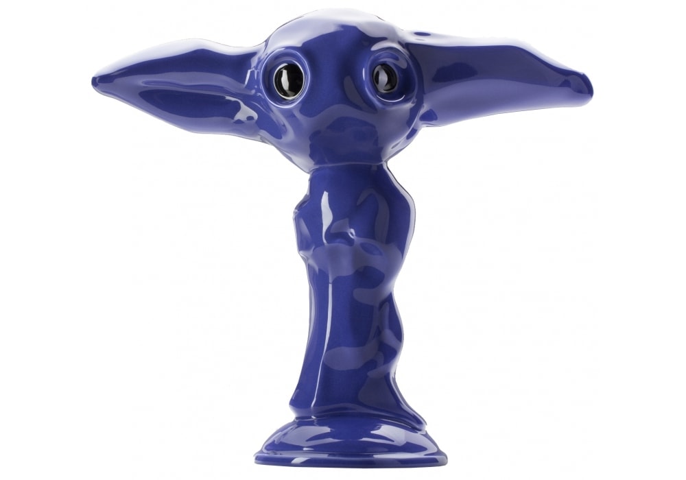 small figure made of ceramic in the shape of an elf in a purple tone