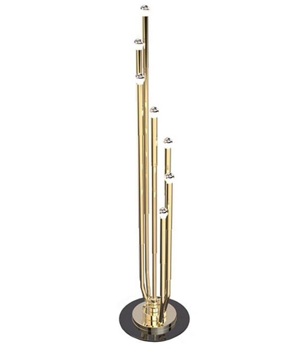 lamp made of gold-colored metal and silver finishes and rotating black base on a white background