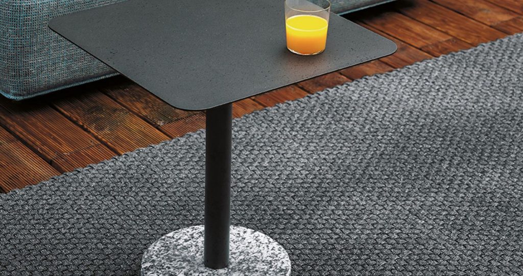 coffee table made in the shape of a square made of white stone base and stainless steel top