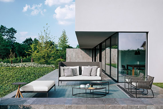 living room set made of stainless steel base and upholstered in its cushions in a tone of white with black