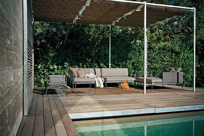 sofa made in the shape of an L in a beige and gray color tone on the outside