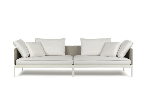 two-part sofas made of white fabric and stainless steel on its base on a white background