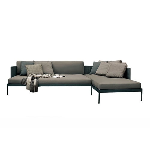 Rod Basket Sofa offers a spacious modular design with deep cushions and a woven backrest, creating a comfortable and elegant setting for outdoor lounging.