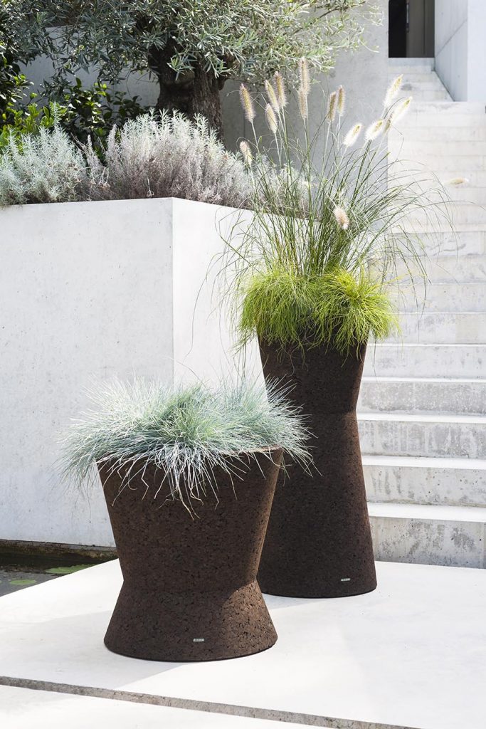 Bush On Three Planter in front of some marble outdoor stairs