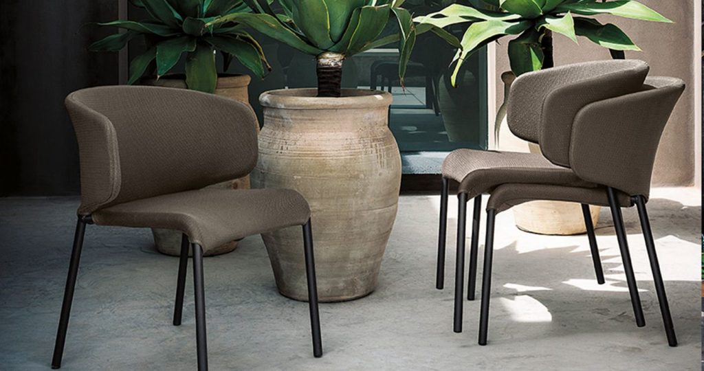 three chairs made of fabric in a dark green color tone and base on aluminum legs