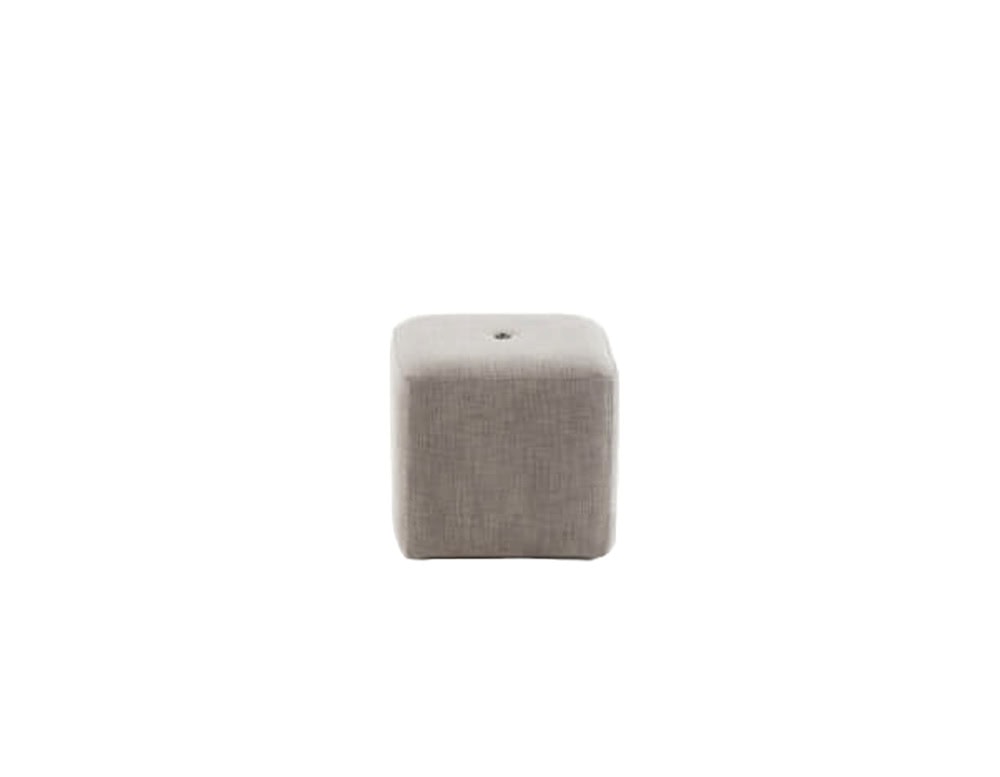 A compact square outdoor pouf in light taupe fabric with a soft cube shape and a single tufted detail.