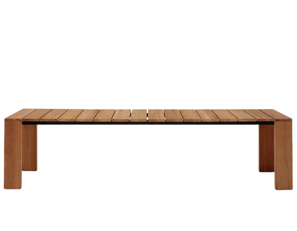 Rod Pier Table is a long wooden outdoor table with a slatted surface and sturdy legs, designed for larger gatherings or open-air dining.