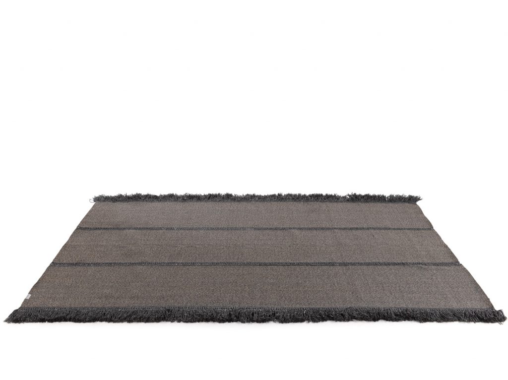 Triptyque One Rug in black color in front of a white background
