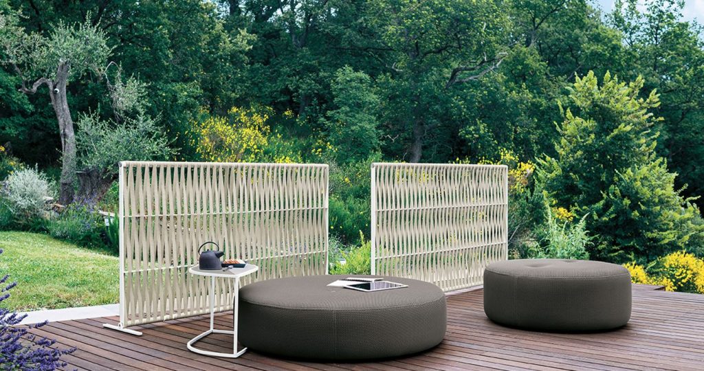 Pair of Wing Two Horizontal Screen behind some couches on a patio with trees in the background