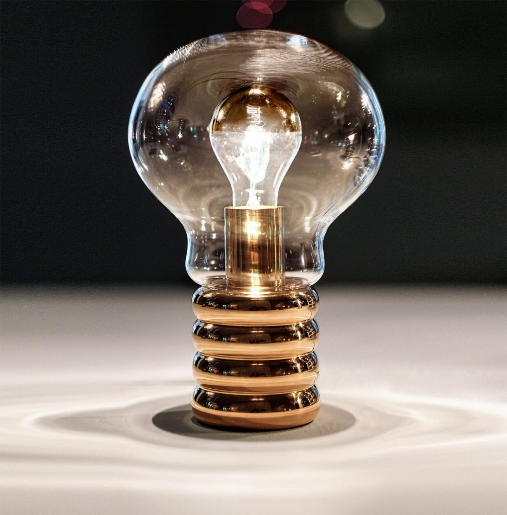 Bulb Brass illuminated on a white table