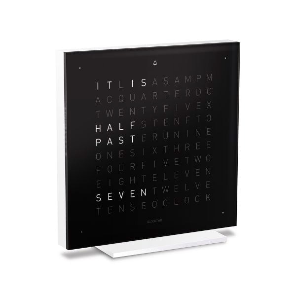 Angled view of QLOCKTWO Touch in black in front of a white background