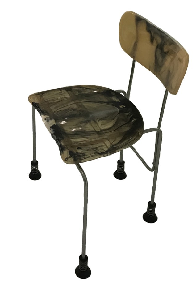 sculptural auxiliary chair made of steel and resin-coated plastic base in a brown tone with black and yellow finishes on a white background
