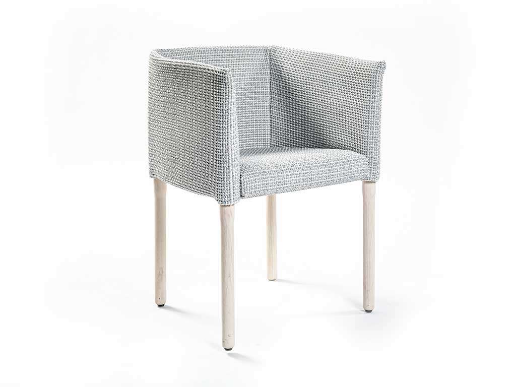 Angled view of Elsie dining chair in front of a white background