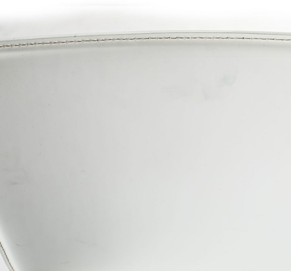 Close up of Nobile barstool back stitching in front of a white background