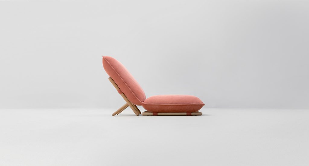 Side view of Hiro Lounge Chair in front of a white background