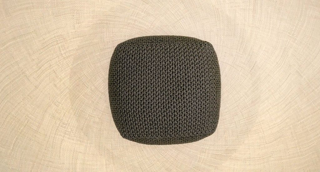 Top view of Picot two thousand twenty one in green on top of a light tan background