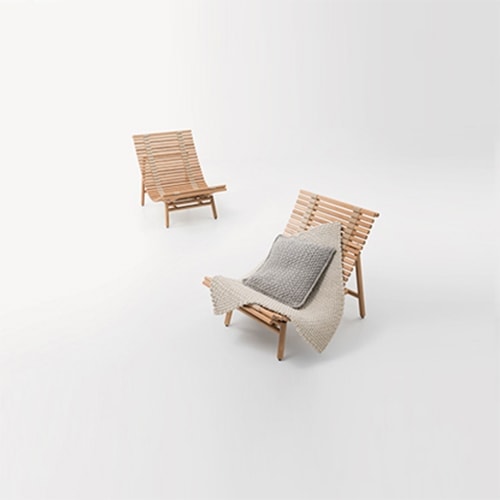 Pair of Shibui Armchair in front of a white background