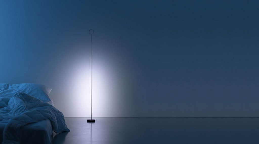 Anima light shining against a white wall in a dark room