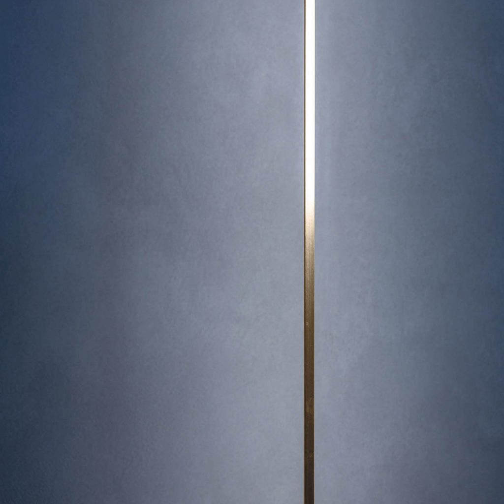 Masai light shining against a blue wall