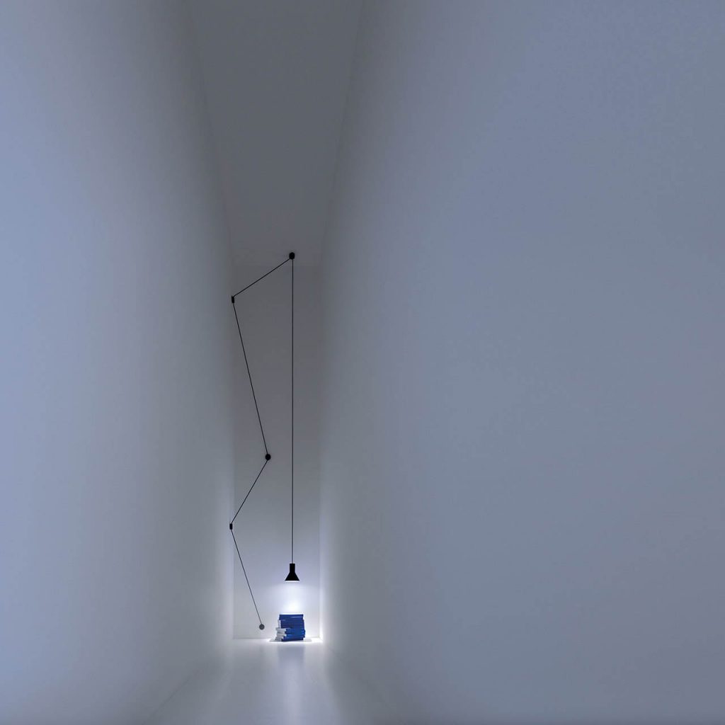Neuro light illuminated at the end of a long white hallway