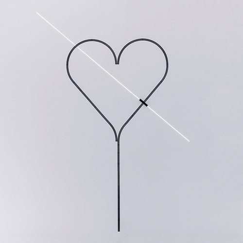 Rail hanging on a white wall illuminated