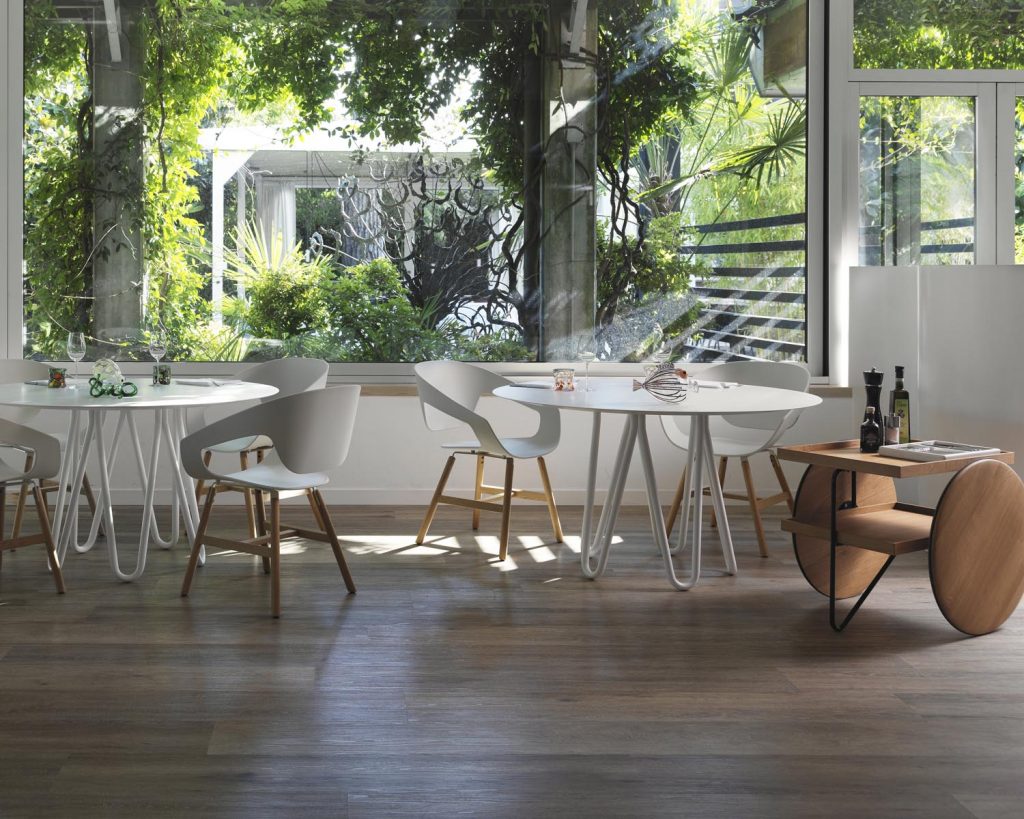 Chariot outside next to a white table and chairs