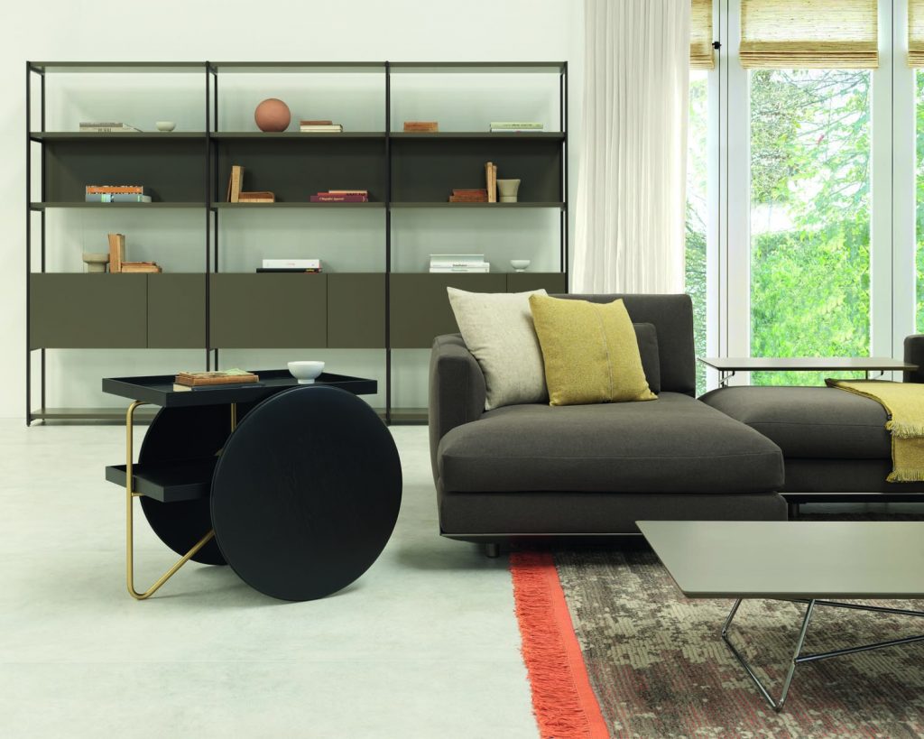 Chariot in black next to a dark couch