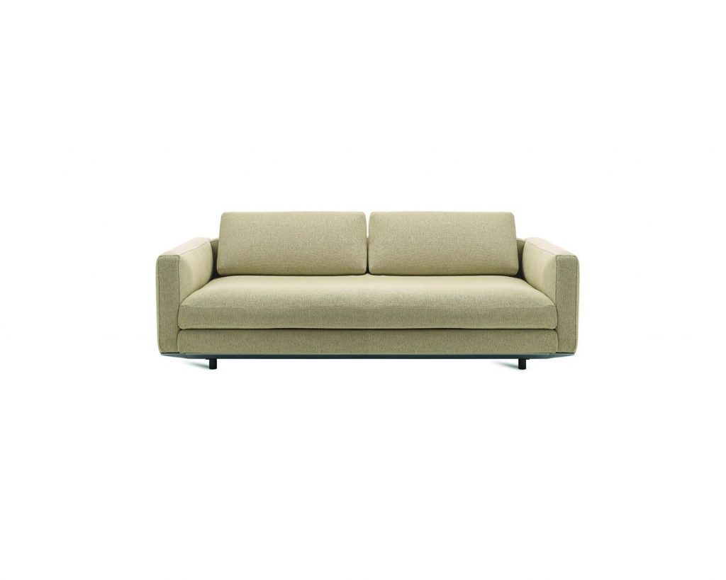 Cream colored Miles with narrow armrests and a white background