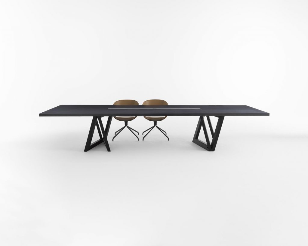 Quadror Three with two chairs in front of a white background