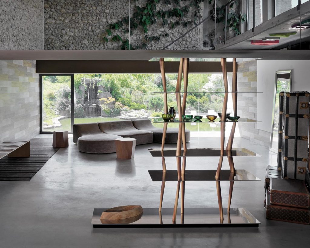 Sendai in a living room with glass and a couch behind it