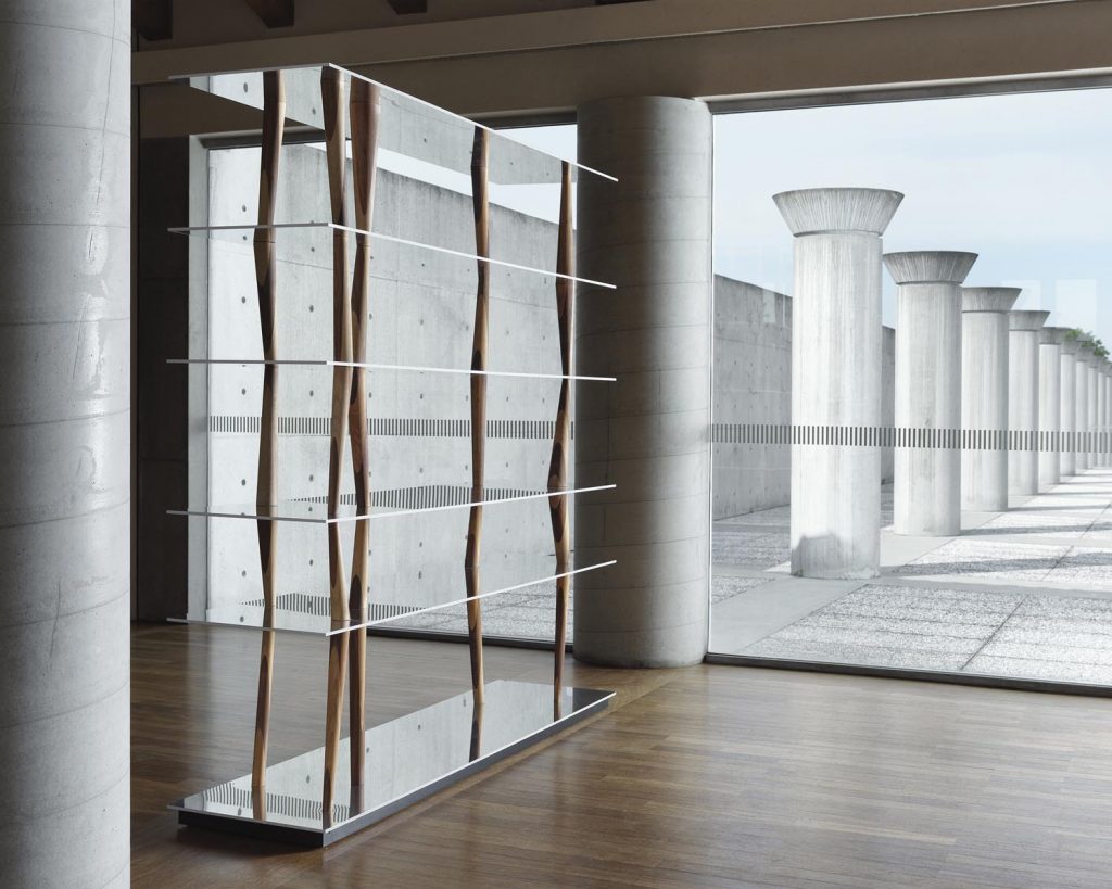 Sendai in a glass room with dark wood flooring