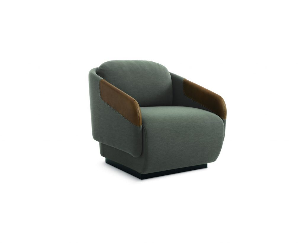 Front angle of a dark grey Worn chair with dark brown armrests in front of a white background