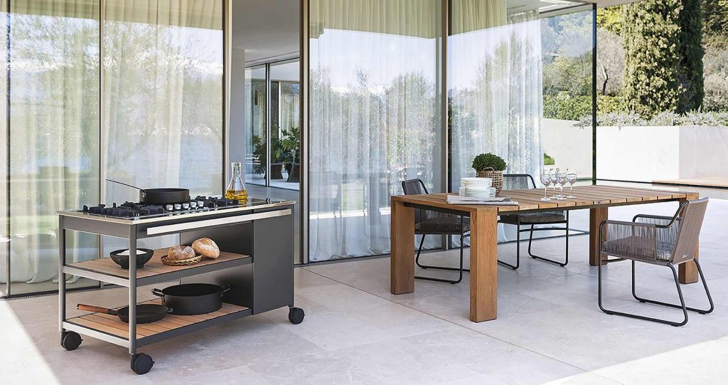 Norma One Cooking module in an outside setting with a table next to it