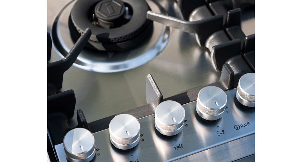 Close up of the metallic knobs of the Norma One Cooking module