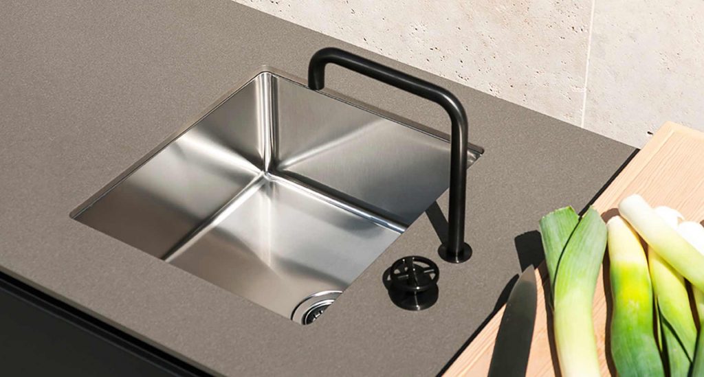 A close up of the faucet on the Norma Two Sink