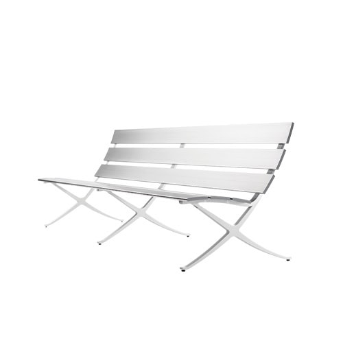 The BD Bench B Outdoor is crafted from aluminum with a sleek, slatted profile and cross-frame legs, offering a modern and lightweight solution for exterior seating areas.